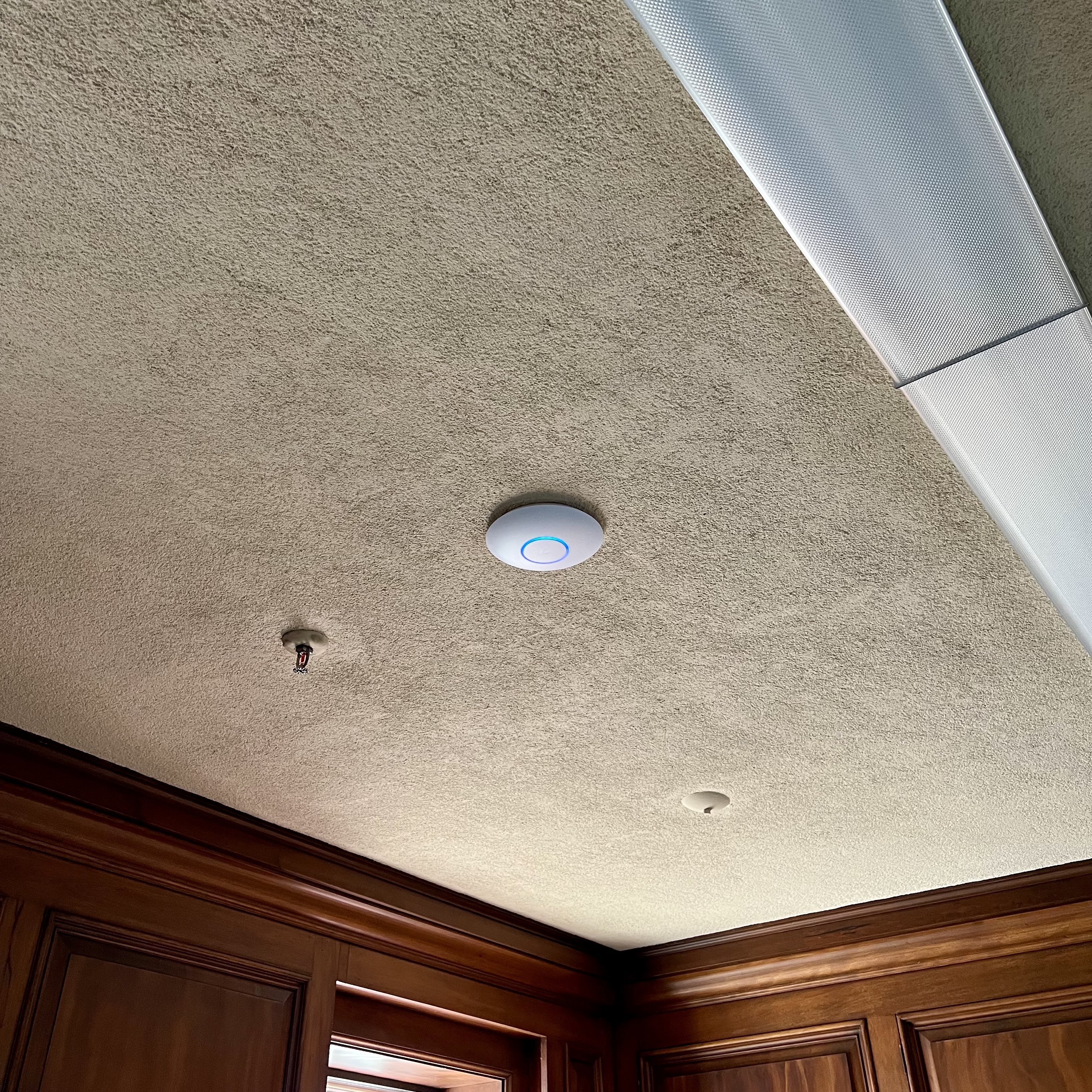 Wi-Fi access point mounted on ceiling