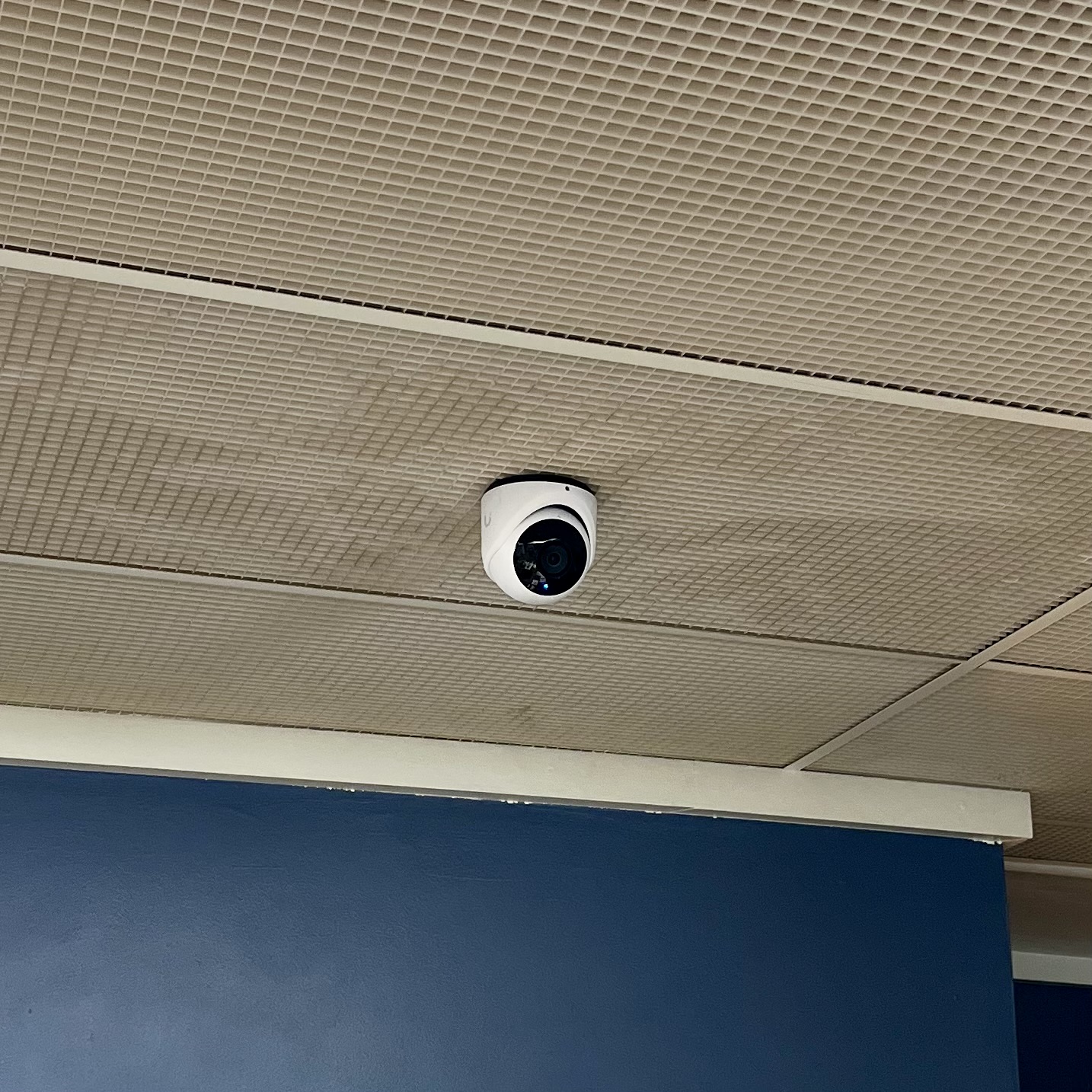 Security camera installed on building exterior